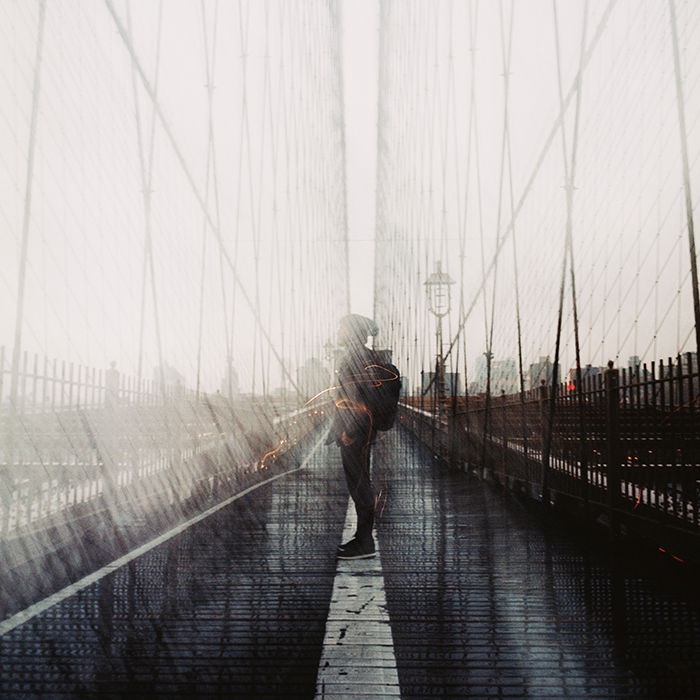 Double exposure effect combined with tilt-shift of a man and the city.