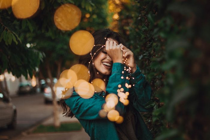 portrait photo of a woman with fairy lights