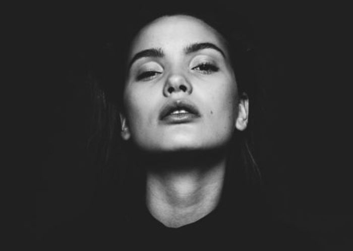 black and white portrait photo of a woman with butterfly lighting