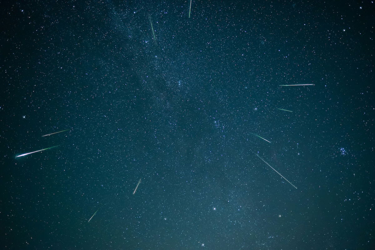 A night sky image of shooting stars in the Milky Way