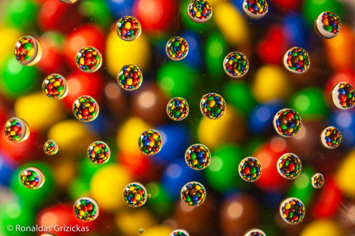 Colorful round candies with shiny reflective surfaces. 