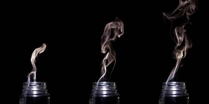 Triptych of smoke coming out of a glass jar