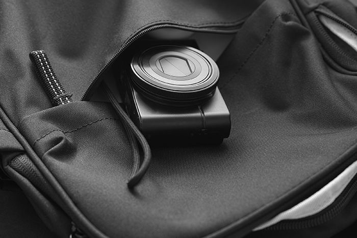 Compact camera in a backpack.