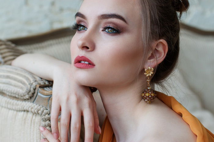 Woman posing with chin on hand 