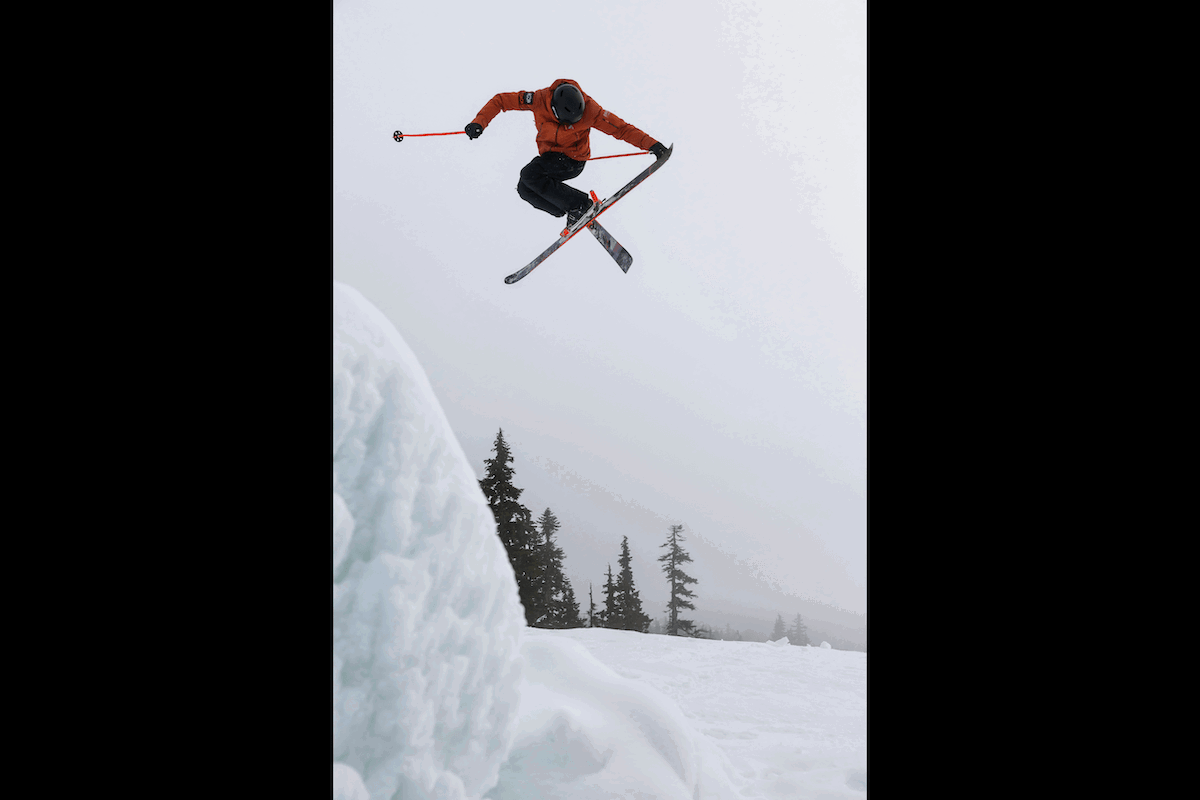 A skier twisting in the air doing a trick high above snow for high-speed photography