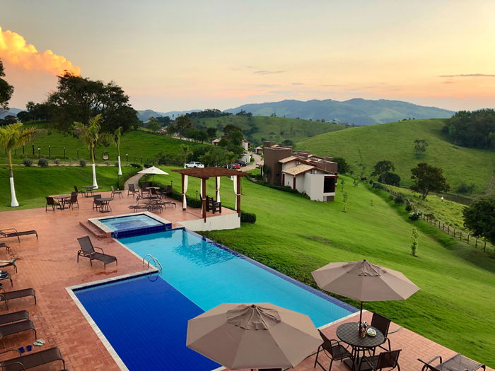 Exterior of a countryside hotel with swimming pool