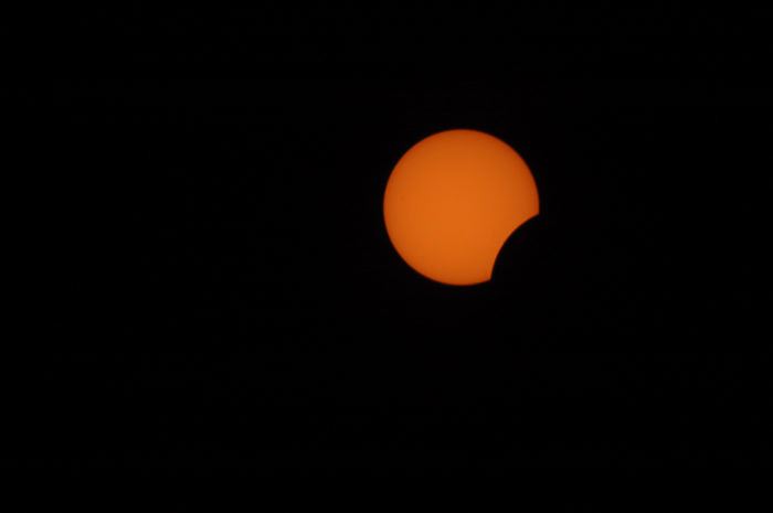 photo of the moon blocking out the sun