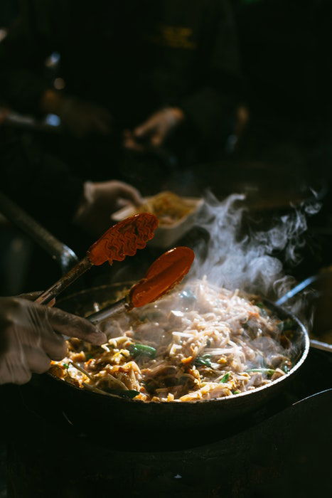 Indian food lit with a beam of light 