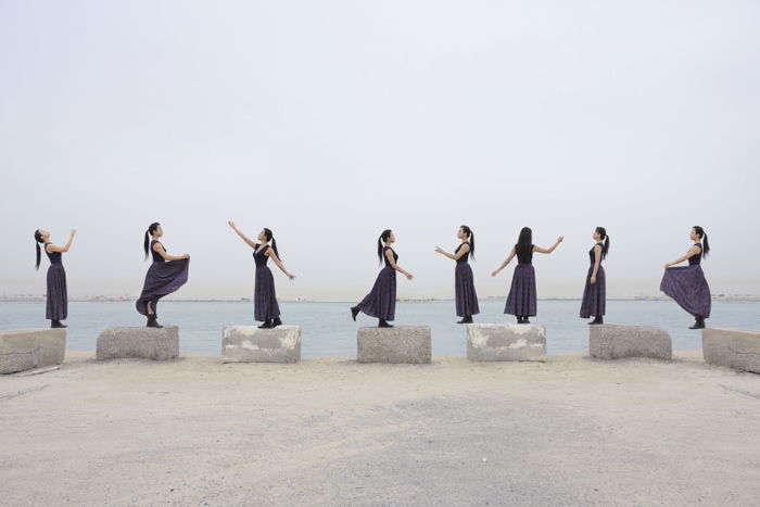 A multiplicity photog of a woman posing in eight different ways on different pillars for creative editing ideas