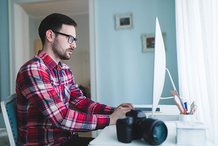 Photographer editing photos.