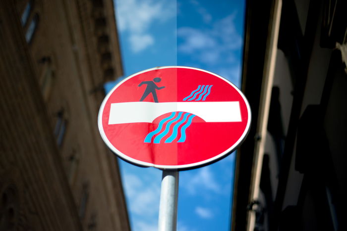 before and after shot of a street sign after correcting white balance