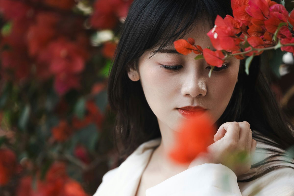 Close-up portrait of a woman with flowers for a photography challenge