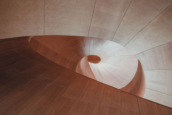 A spiral staircase shot from above illustrating asymmetrical balance