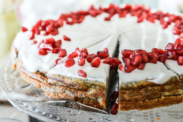 Close up of a frosted poppy seed cake