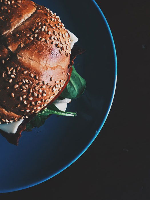 Flat lay food photo of a burger on a plate