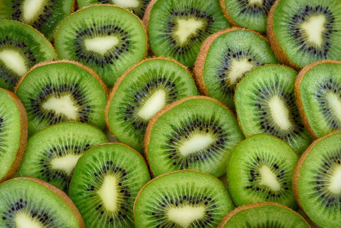 Close up fruit photography of many slices of kiwi