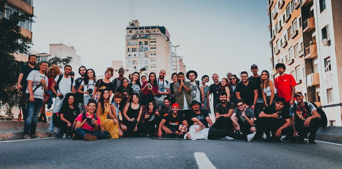 A large group photo outdoors