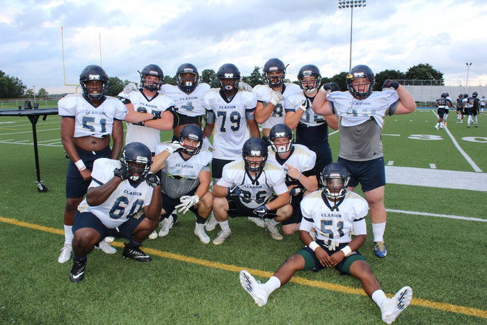 A group photo of a rugby team on the sports field