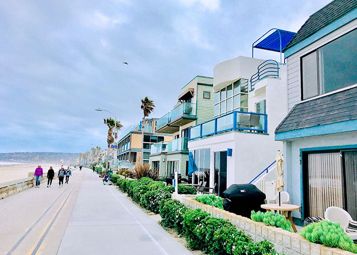 Street photograph of properties in the beach.