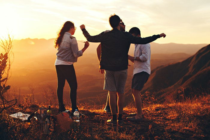 A group having a picnic at sunset