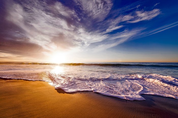 Waves rolling onto a sandy beach