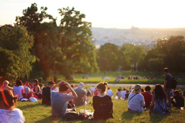 Large group of people hanging out at an outdoor festival