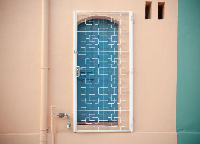 photo of a blue window with asymmetrical balance