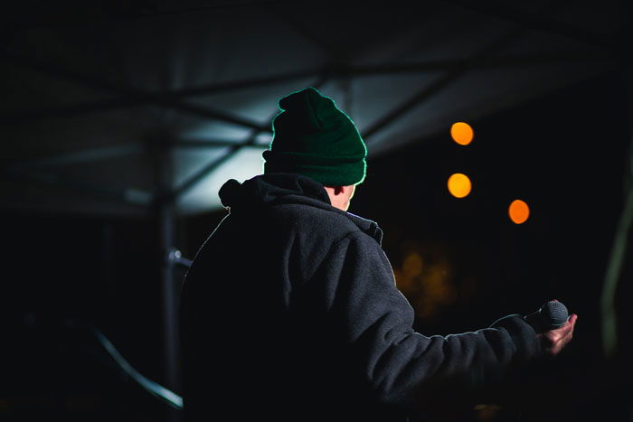 The back of a man onstage