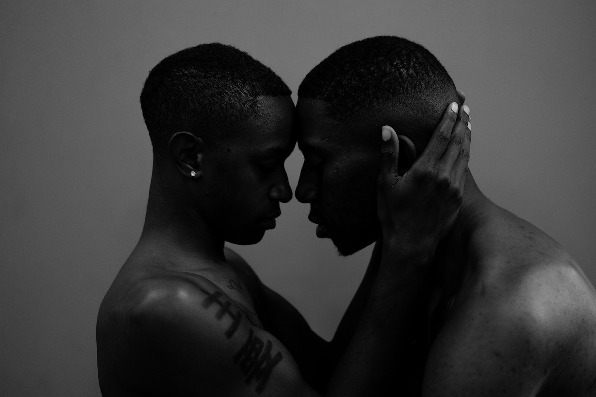 Black-and-white photo of an embrace for couples boudoir photography