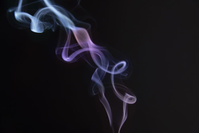 Smoke trailing from an incense stick 