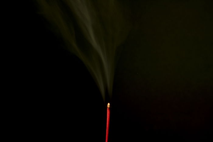 Smoke trailing from an incense stick 