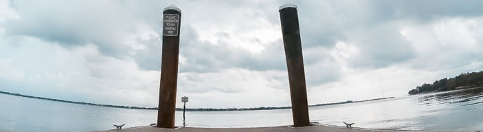 A dock with the horizon in the background, viewed from a low angle. 