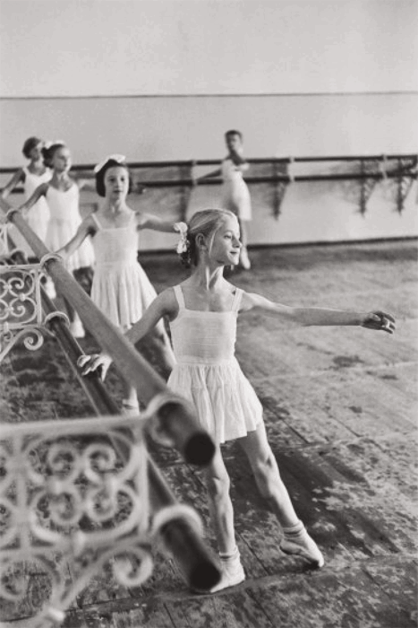 a black and white henri-cartier bresson image of 5 dancers at the bolshoi ballet school