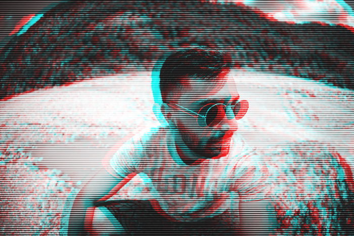 Glitch effect photo of a man in sunglasses