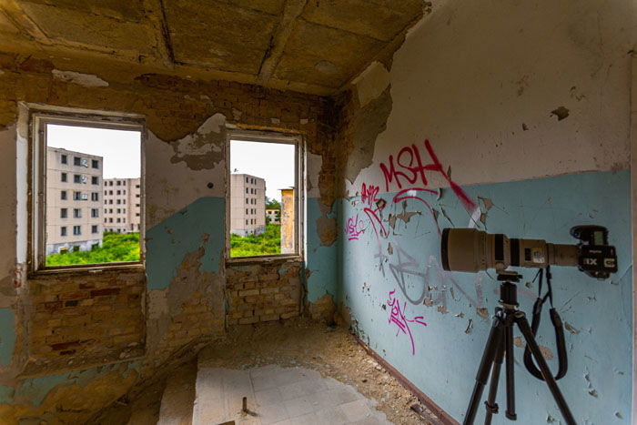 A DSLR fitted with V860II flash with the X1T radio trigger on a tripod in an abandoned building