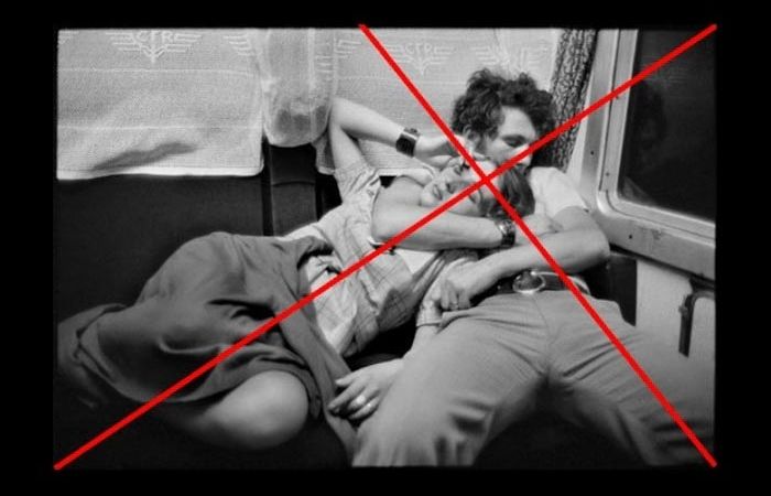 a black and white henri carter bresson image of a man holding a woman on the train with diagonal lines overlay