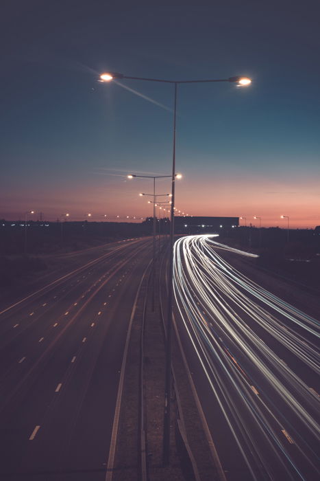 iphone long exposure photography on a road showing light trails