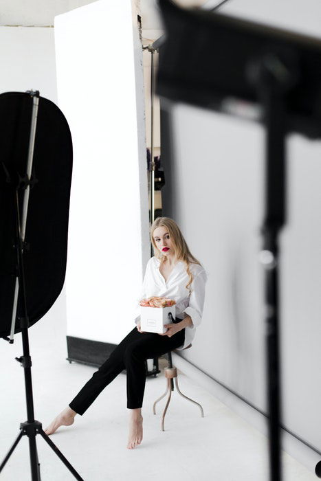 A blonde model posing for a portrait