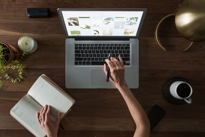 Overhead shot of someone working on a laptop