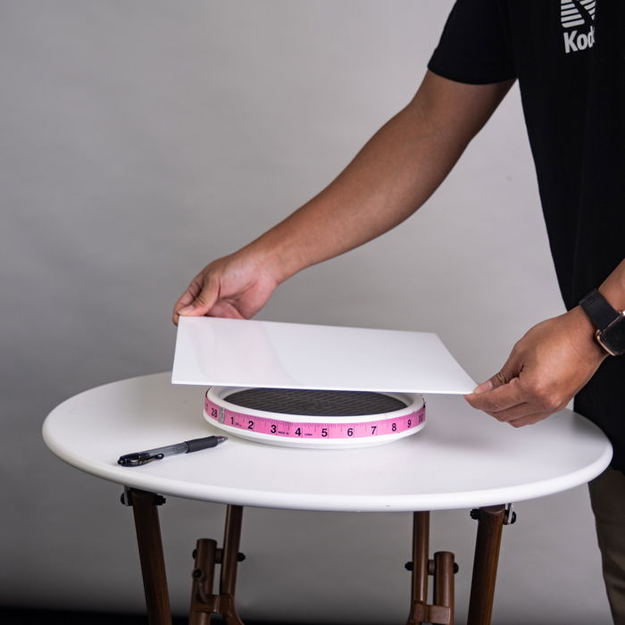 A man makingr a DIY Turntable for 360 product photos