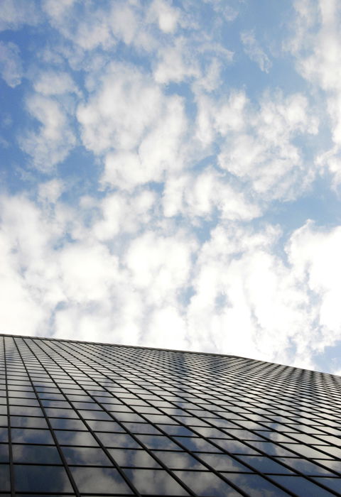 Reflection of clouds on highrise window