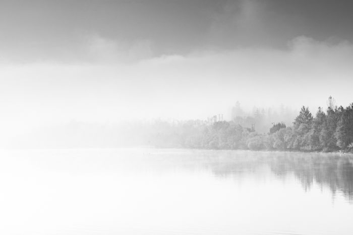 Abstract contemporary art, fog over lake in black and white