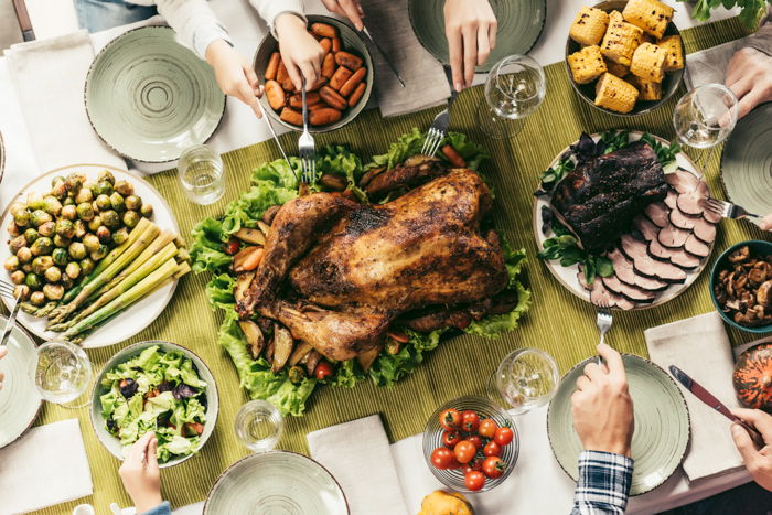 Autumn photography of a Thanksgiving turkey and side dishes on a table