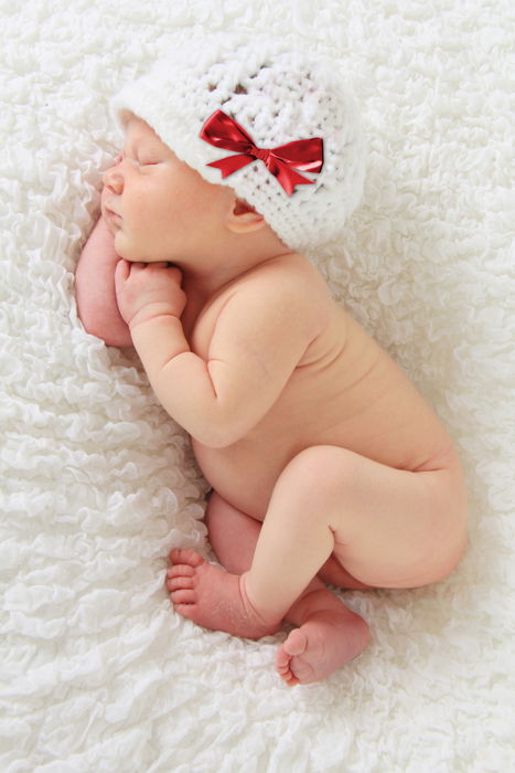 Sweet baby's first Christmas portrait on a woolen blanket