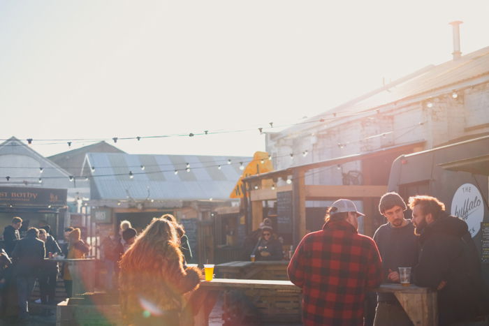 an image of a crowd of people eating outdoors