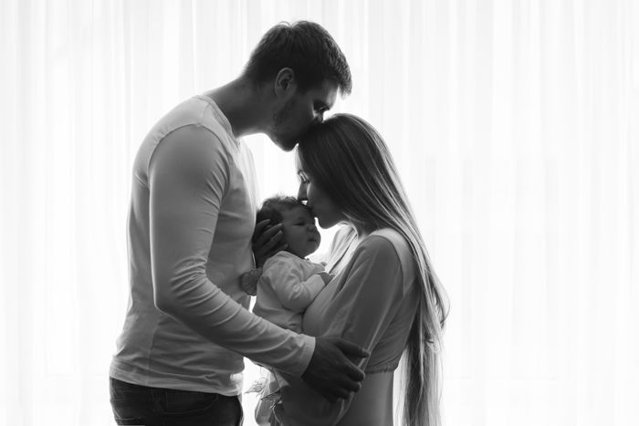 Baby posing with their parents