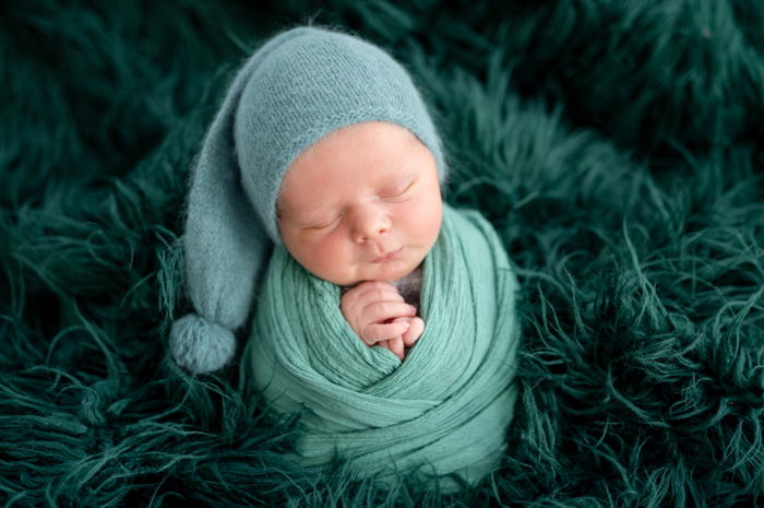 potato sack pose with green blanket and green hat