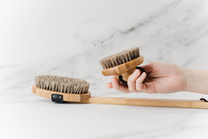 Product photography image of brushes with a model's hand