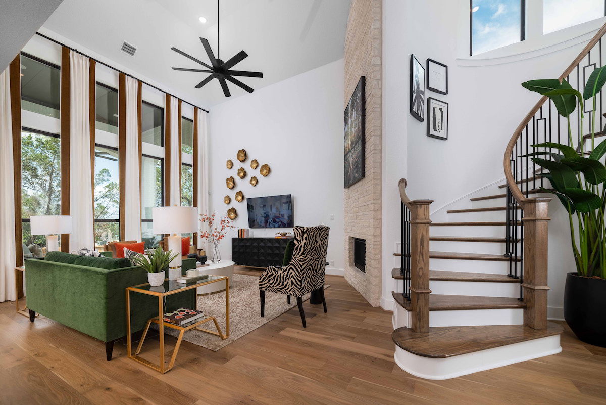 Real estate shot of a living room and stair case shot with a wide-angle lens