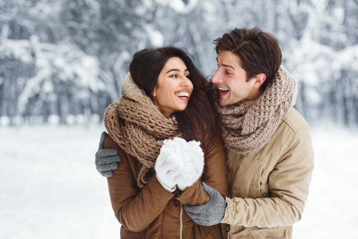 A couple posing in the snow